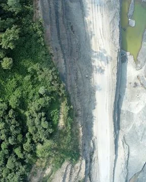Direct top-down vertical aerial view of a mining site boundary, showing a s.. Stock Photos