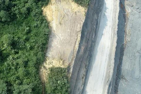 Direct top-down vertical aerial view of a mining site transition zone, show.. Stock Photos