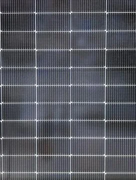 Direct view of geometric pattern of solar panel cells for clean energy at a.. Stock Photos