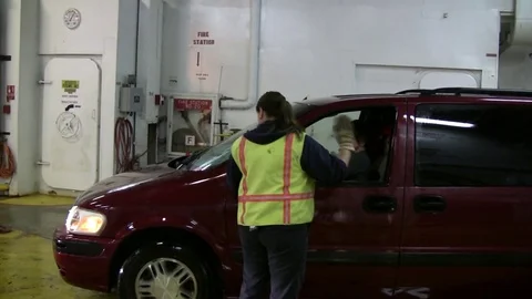 Directing a driver to parking space in Alaskan ferry. Video stock 79414035