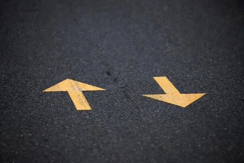Direction arrows drawn on the road Foto stock