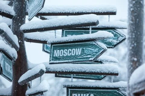 Direction to different places of the world indicated in a sign. Stock Photos
