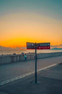 Direction indicator on the background of the city's waterfront 写真素材