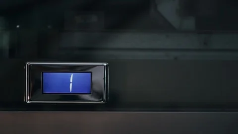 Direction indicator of electronic elevator and floor counter showing cipher one Stock Footage 94143344