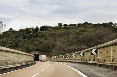 Direction indicators in front of the tunnel. Stock Photos
