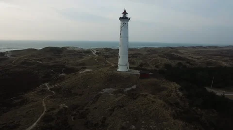 Direction: An old lighthouse showing the way at the Danish west coast 스톡 동영상 65152936