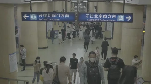Direction Sign Above Commuters in Beijing Subway Concourse 스톡 동영상 341456784