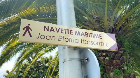 Direction sign post showing Navette Maritime (Nautical Shuttle) ferry route Stock Footage 345145739