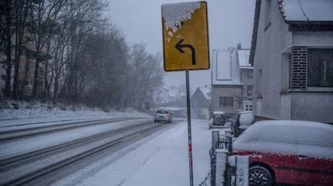Direction sign in snow Stock Photos