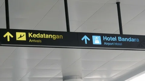 Direction sign with symbols of Arrivals and Airport Hotel Stock Footage