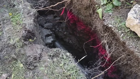 Directional Drill Bit Entering Hydrovac Pit for Street Lighting Electrical Stock Footage 345096847