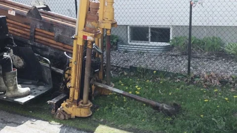 Directional Drilling Machine Driving Bit Into Ground for Street Lighting Stock Footage 345096925