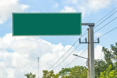 Directional green blank empty road sign in Tulum Mexico. Stock Photos