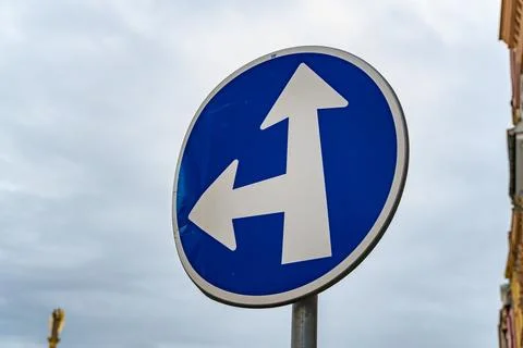 Directional road sign indicating multiple routes for vehicles at an intersection Stock Photos