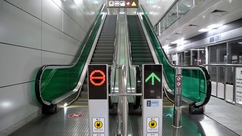 Directional sign light to indicate the direction of operation of the escalator. Stock Footage 118119506