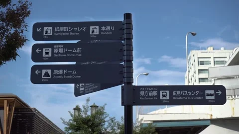 Directional Signs in Hiroshima to Atomic Bomb Dome, Genbaku Dome-mae, Kencho-mae Stock Footage 268444325