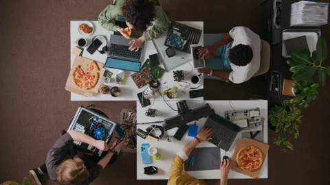 Directly Above of Four Diverse Programmers during Workday at Desks in Office Stock-Footage 312455245