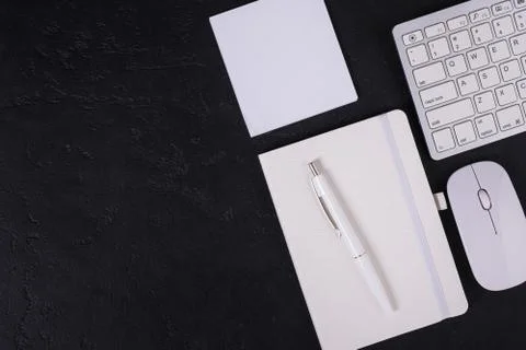 Directly above office workplace with notebook and keyboard and mouse with cop Stock Photos