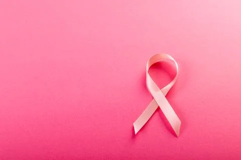 Directly above shot of breast cancer awareness pink ribbon isolated on pink Stock Photos