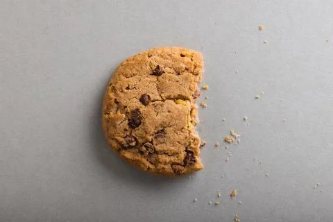 Directly above shot of half eaten cookie on gray background with copy space Stock Photos
