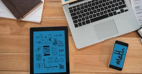 Directly above shot of technologies with diary and papers on wooden table Stock Photos