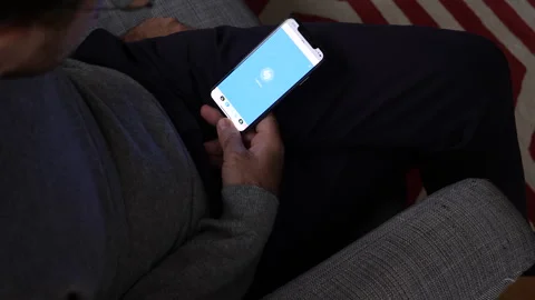 Directly above view of male using Shazam application that can identify music, 스톡 동영상 250515278