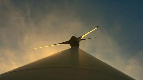 Directly Below Against Sky and Clouds in Sunset a Wind Turbine with Sunlight Stock Footage 291032872