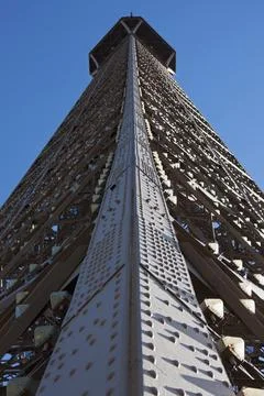 Directly below shot of Eiffel Tower against blue sky, Paris, France Stock Photos