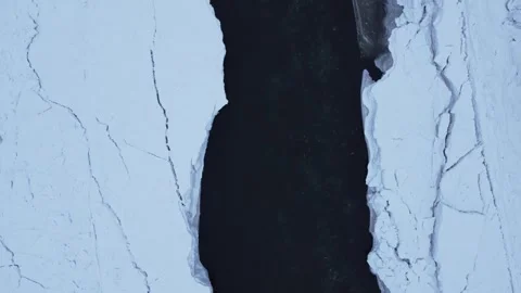 Directly over river in winter looking straight down Stock Footage 310576499