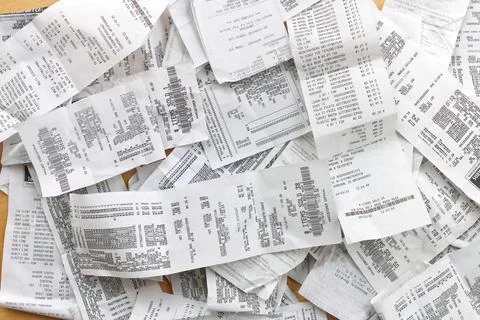 Directly Overhead Flatlay Full Frame Image of Receipts Ready for Accounting Stock Photos