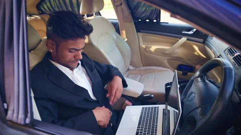Director Begins Work on Laptop Inside Parked Car Stock Footage 310717475