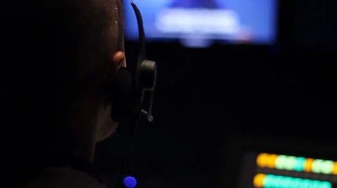 Director on comm - Over the Shoulder Stock Footage 34130699