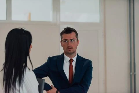 The director conducts a conversation with the Stock Photos