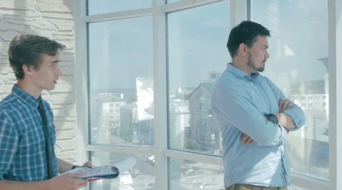 Director discuss project with employee in new modern office Stock Footage
