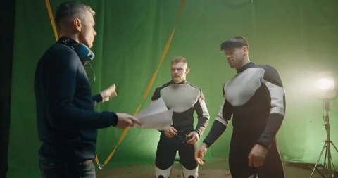 Director giving instructions to actors Stock Footage 124884812