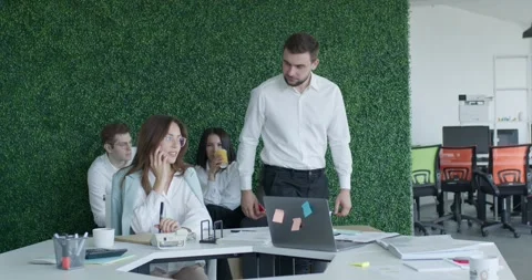 Director having an argument with employee in office, scolds for talking on phone Stock Footage 262030867