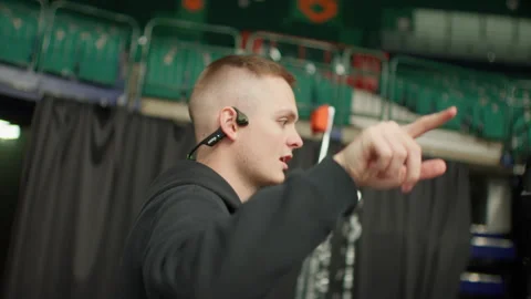 Director with headset issues clear commands to crew Stock Footage 303277527