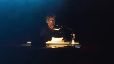 Director reading the script at the table Video stock 201426709