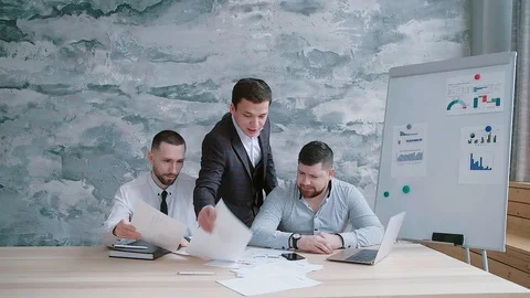 Director throws papers of new company development strategy Stock Footage 125635488