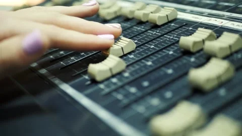 The director uses a mixing console Stock Footage 139384483