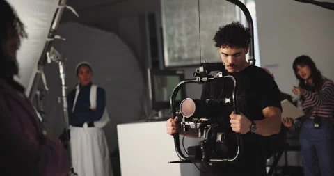Director, videographer and video camera with actress for commercial or Stock Footage 312681977