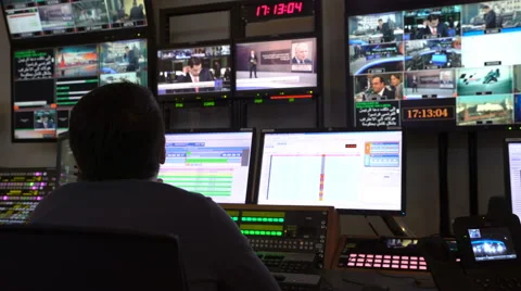 Director works in a hardware remote control unit TV studio. Stock Footage 62216896