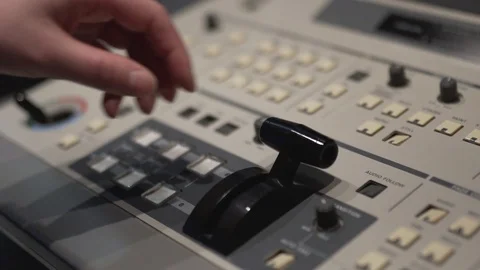 Director's television remote control, hand switches the toggle switch 库存影片 124879405