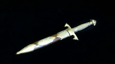 The dirk with diamonds in scabbard on a black background. Shot in motion Stock Footage 121601910
