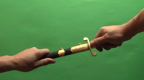 Dirk removed from its sheath on a green background Stock Footage 978668