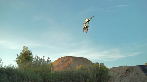 Dirt bike Hitting Jump Doing Trick Stock Footage 121389385