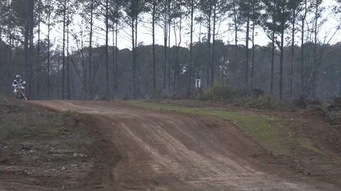 Dirt bikes racing over small hills Video stock 85841208
