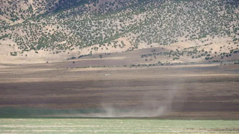 Dirt devil moving in slow motion through the Utah desert Stock Footage 339250597
