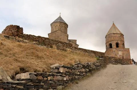 Dirt path leading to the Gergeti Trinity Church Stock Photos