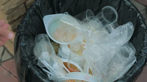 Dirt Plastic tableware in the bin Stock Footage 67700035
